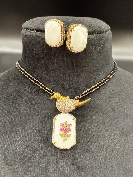 Blackbeard’s with peacock pendent on carved gemstone