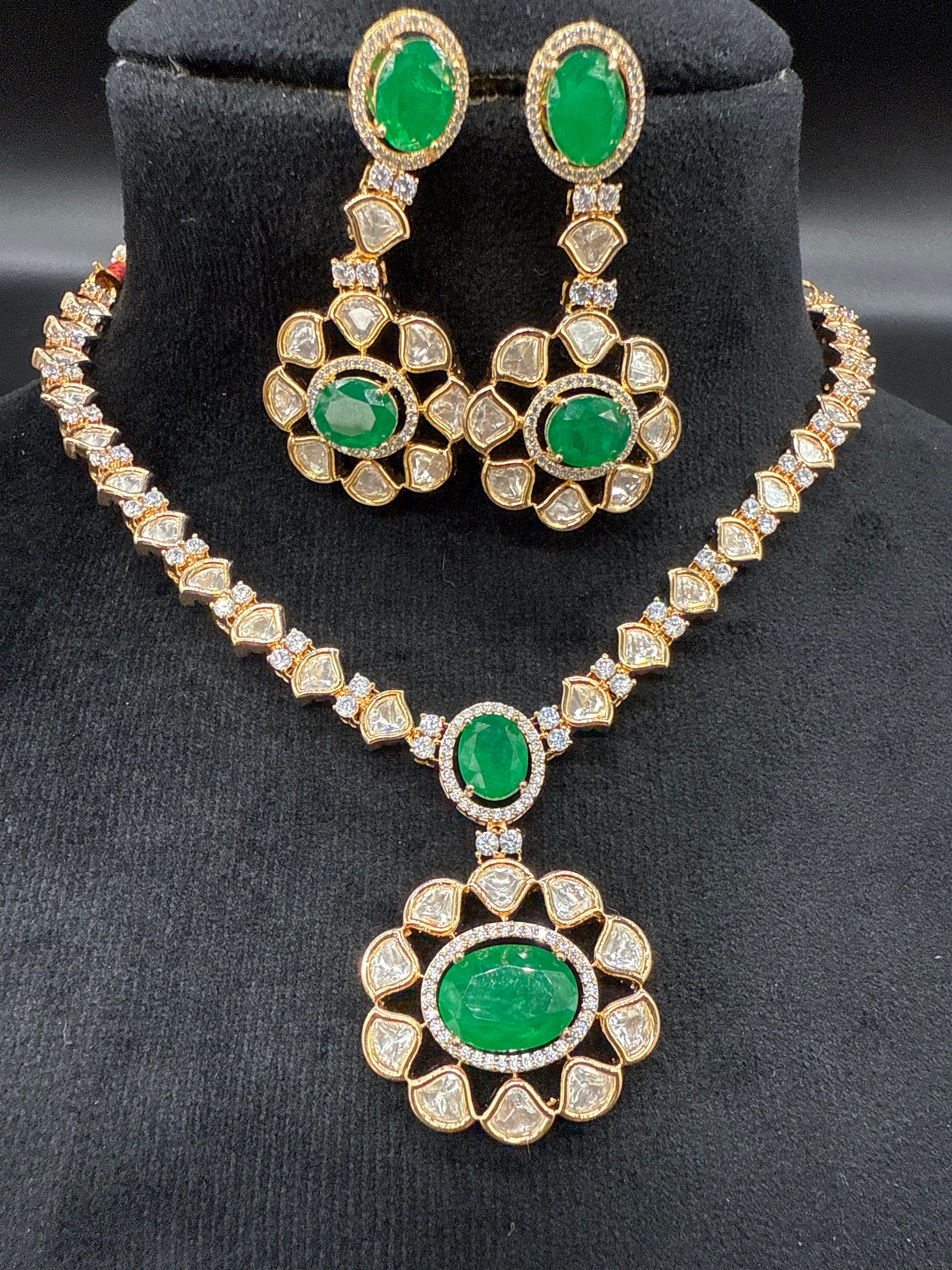Kundan mozonite set with emerald stone- short