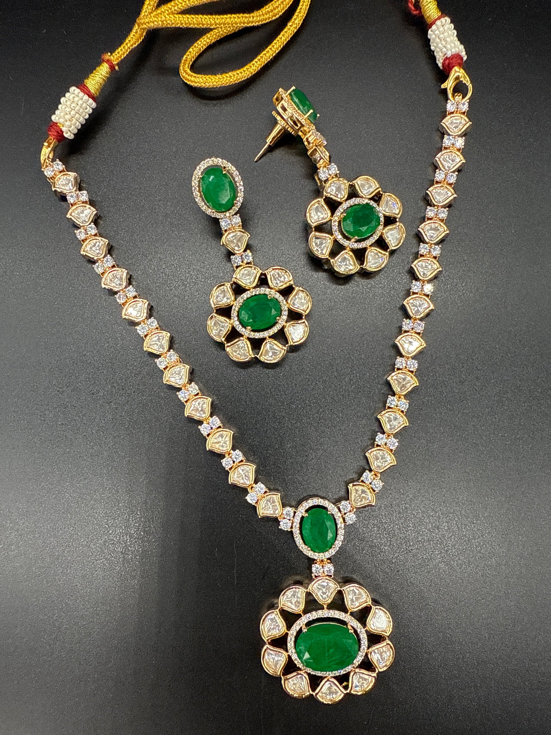Kundan mozonite set with emerald stone- short