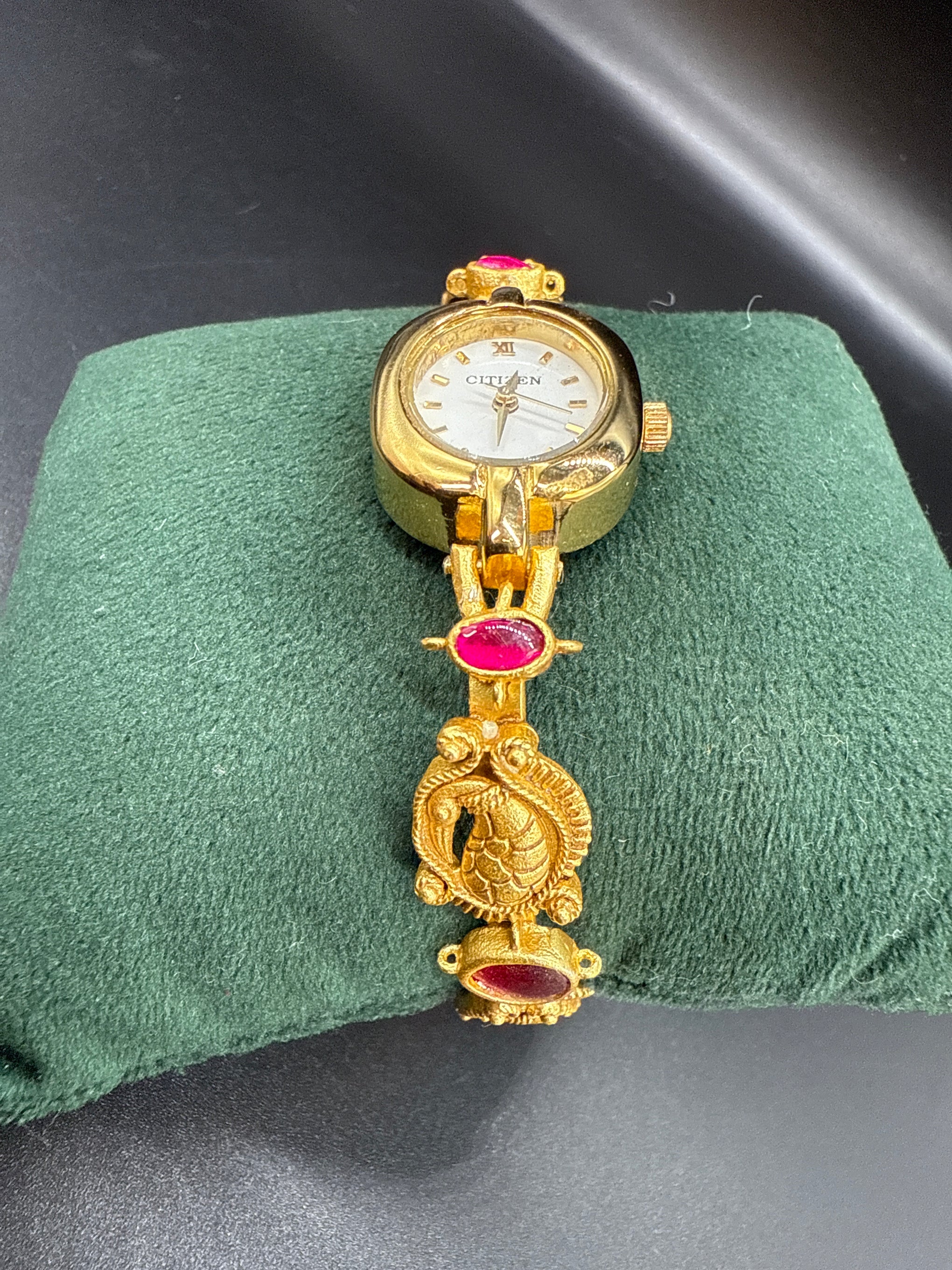 Ruby peacock gold bracelet watch