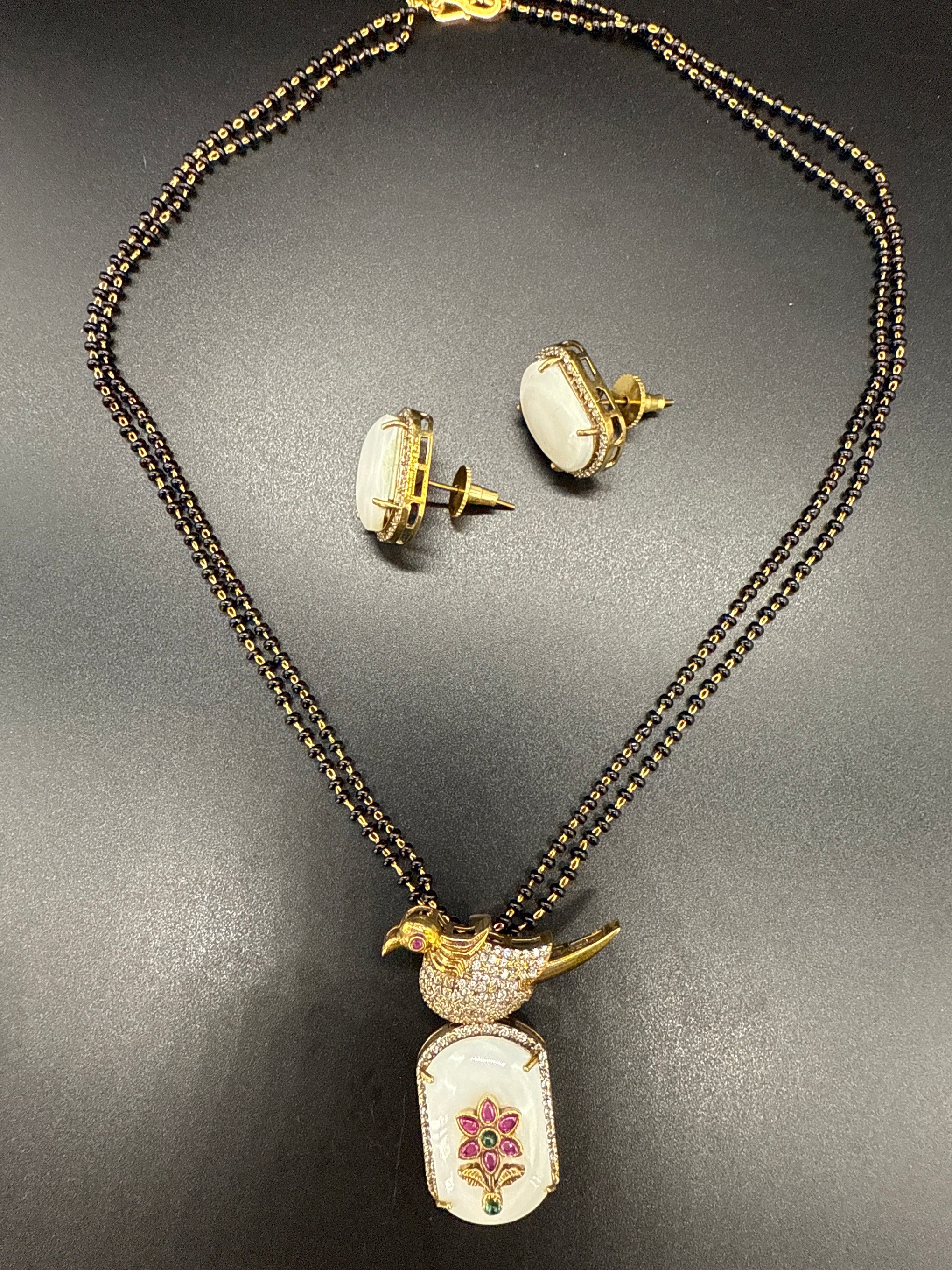 Blackbeard’s with peacock pendent on carved gemstone