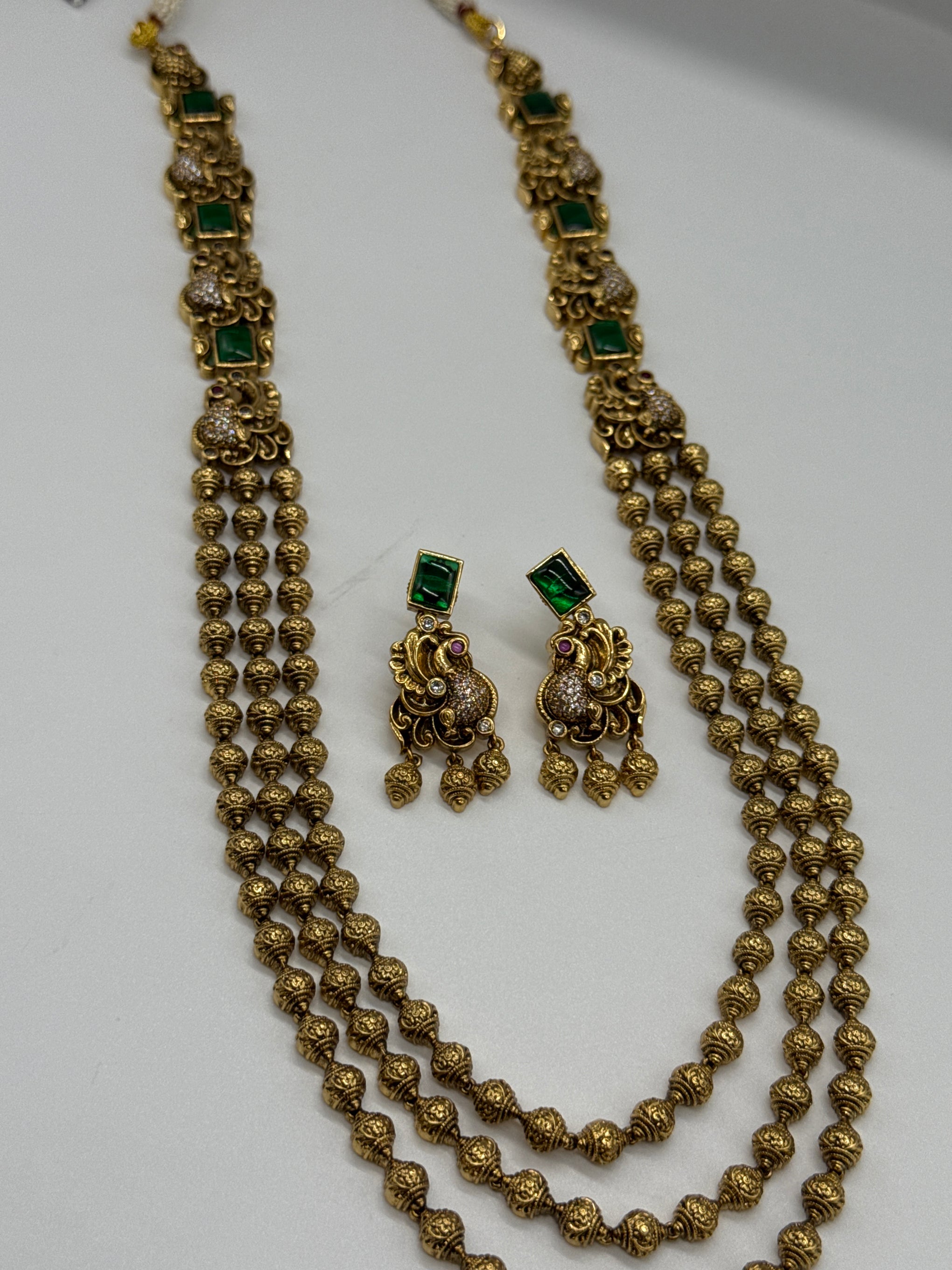 Nakshi balls set in emerald